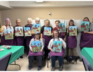 Outreach program class photos of people painting