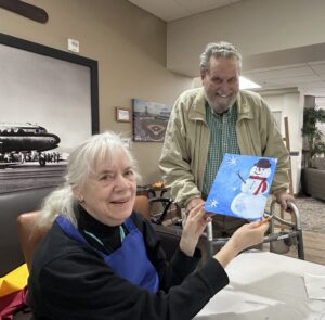 Outreach program class photos of people painting