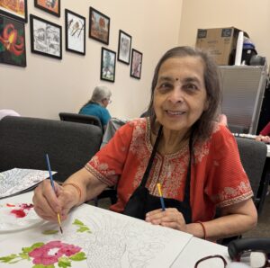 Outreach program class photos of people painting