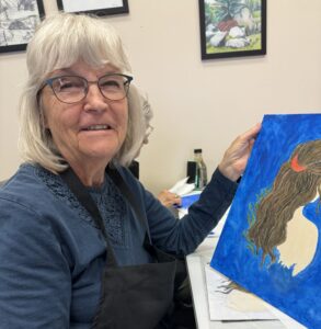 Outreach program class photos of people painting