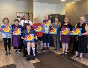 Outreach program class photos of people painting