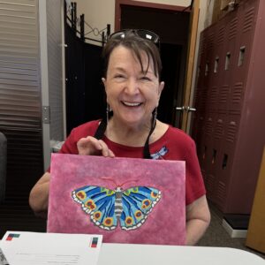 Outreach program class photos of people painting